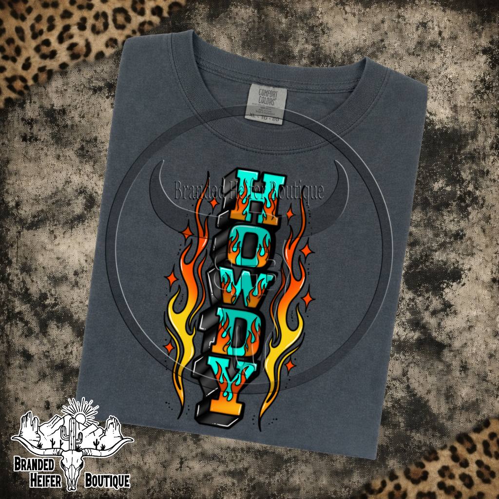 Howdy Flames Graphic Tee in Pepper, turquoise Howdy letters surrounded by tattoo style flames, printed on a Comfort Colors tee