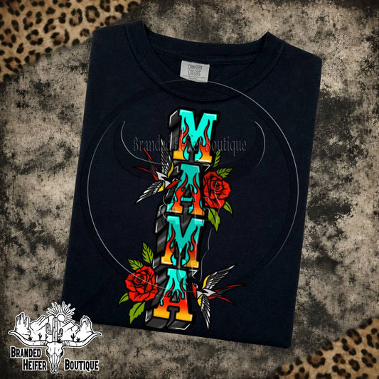 Mama Tattoo Roses Graphic Tee in Black, turquoise Mama letters with traditional tattoo roses and swallows, printed on a Comfort Colors tee