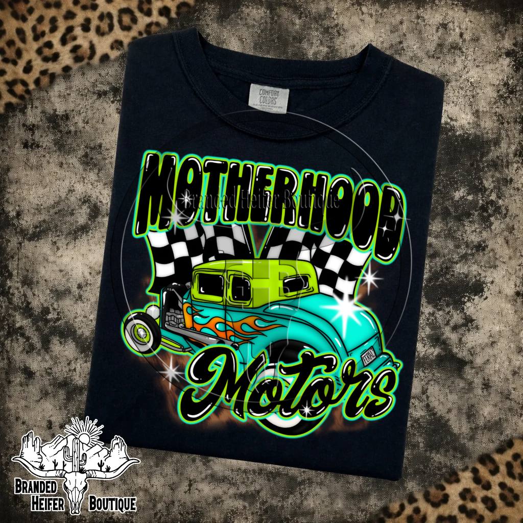 Motherhood Motors Hot Rod Graphic Tee in Black, retro hot rod with checkered flags and green airbrush lettering, printed on a Comfort Colors tee