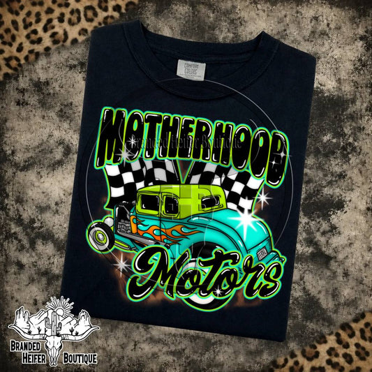 Motherhood Motors Hot Rod Graphic Tee in Black, retro hot rod with checkered flags and green airbrush lettering, printed on a Comfort Colors tee