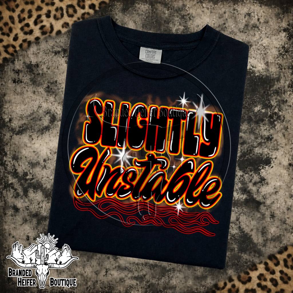 Slightly Unstable Graphic Tee in Black, Slightly Unstable lettering with orange glow and red pinstripe flames, printed on a Comfort Colors tee