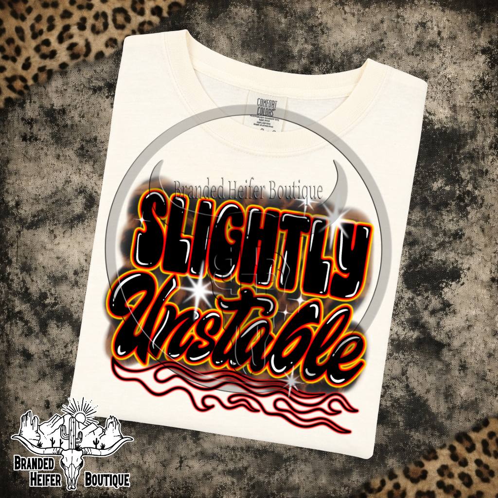Slightly Unstable Graphic Tee in Ivory, Slightly Unstable lettering with orange glow and red pinstripe flames, printed on a Comfort Colors tee